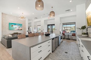 The kitchen is open to the living room and dining room